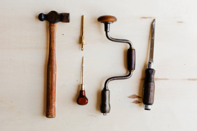 Various tools lying on a white background