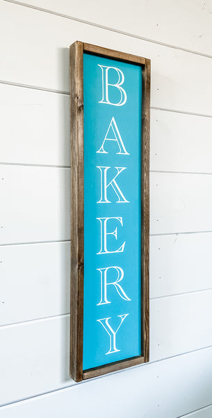 Handcrafted wood sign with the word "Bakery" painted on it