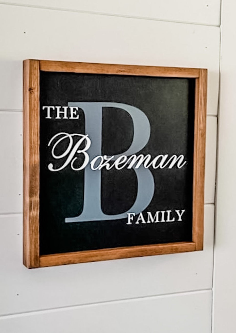 Handcrafted farmhouse style wood sign with family name and large initial