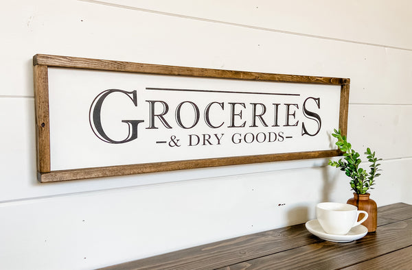 Handcrafted farmhouse style wood sign that reads "Groceries & Dry Goods"