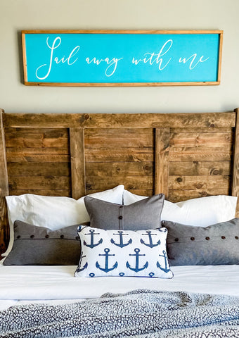 Handcrafted farmhouse style wood sign that reads "Sail away with me"