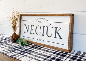 Handcrafted farmhouse style wood sign with the family name and established date