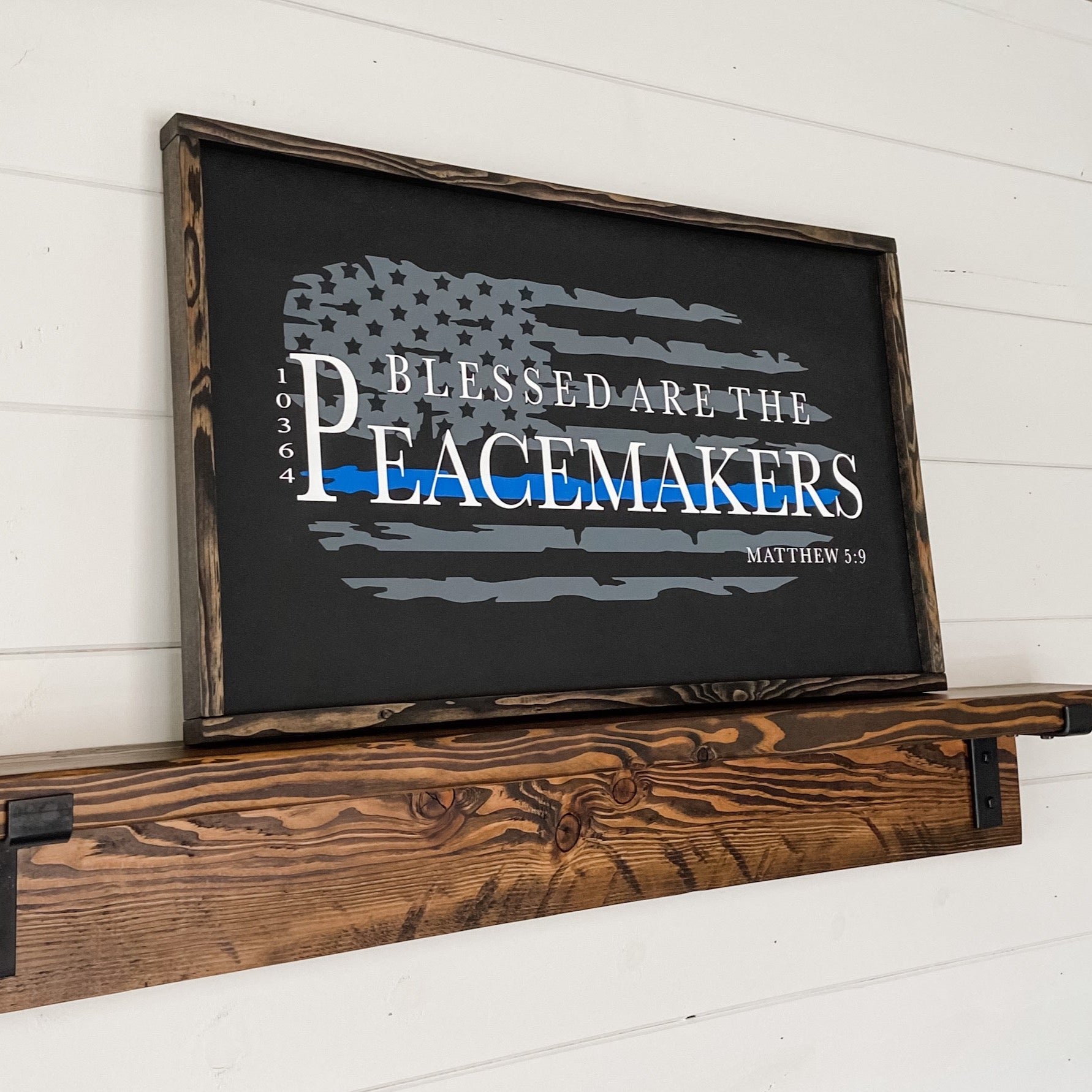 Farmhouse style wood sign with Matthew 5:9 scripture painted on it