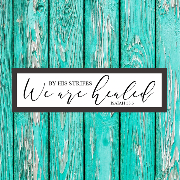 Farmhouse style wood sign with Isaiah 53:5 scripture painted on it.