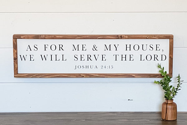 Farmhouse style wood sign with Joshua 24:15 scripture painted on it.