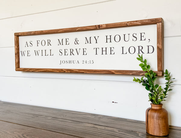 Farmhouse style wood sign with Joshua 24:15 scripture painted on it.